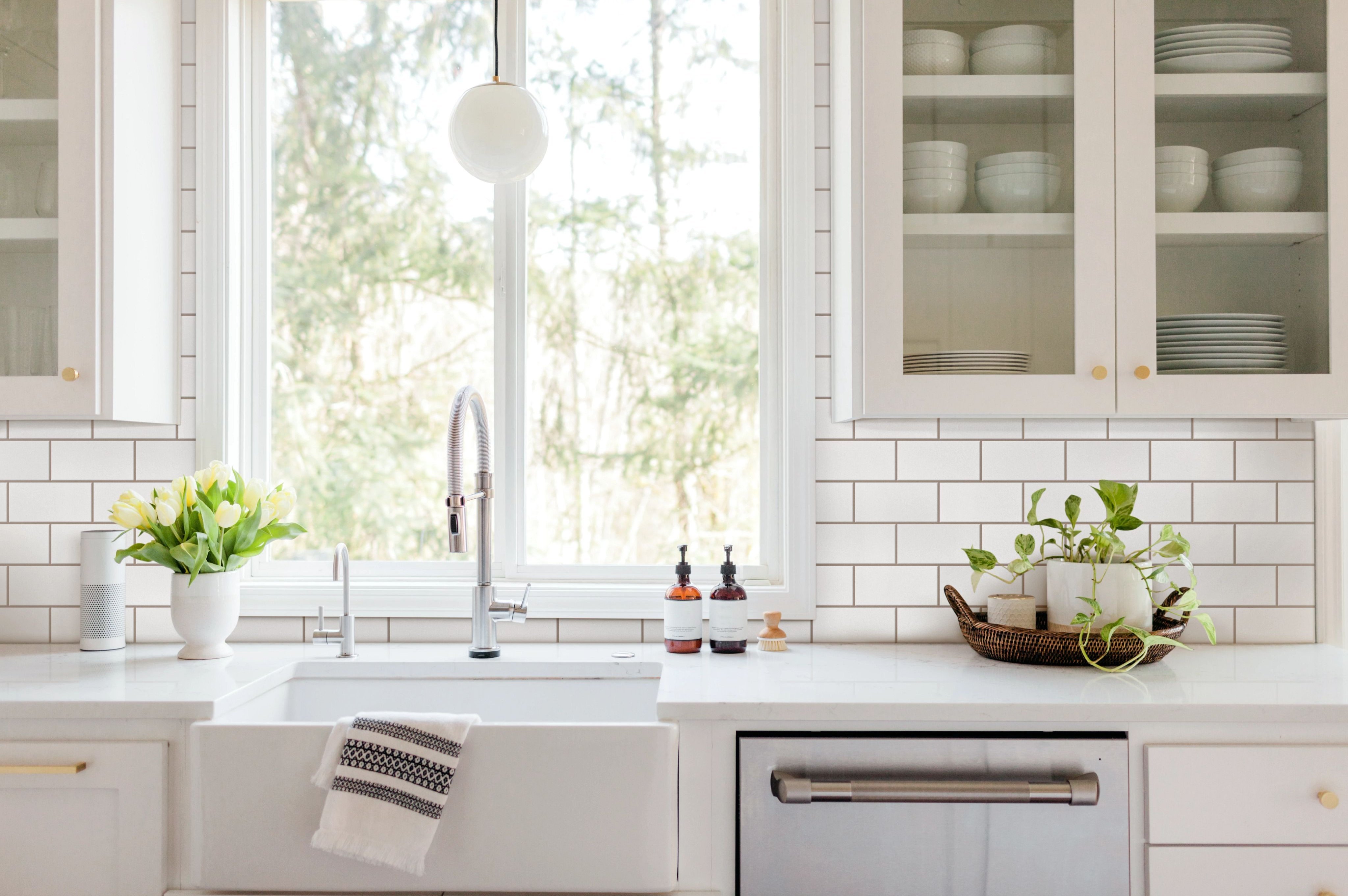 white kitchen with a sink and furniture - bdflooringinc