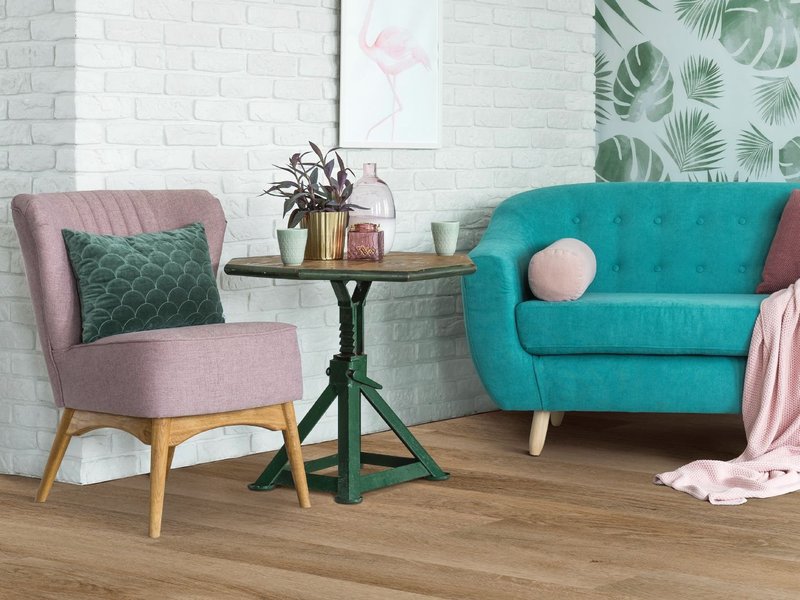 turquoise sofa and a grey chair - bdflooringinc