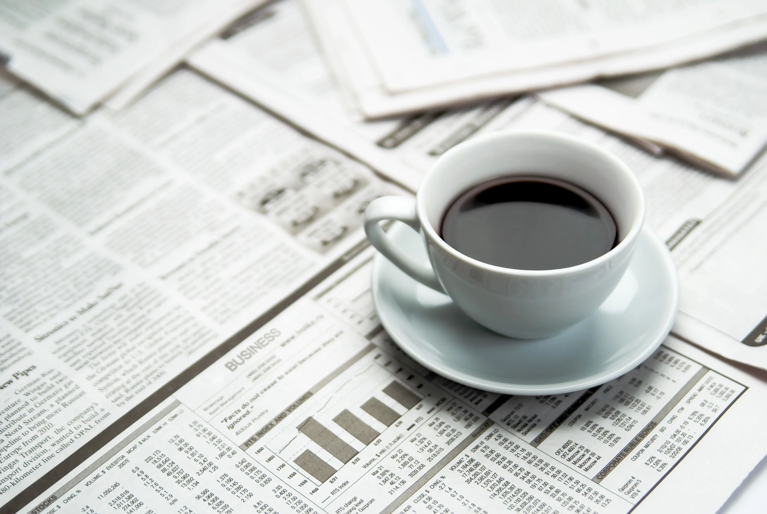 coffee on a newspaper - bdflooringinc