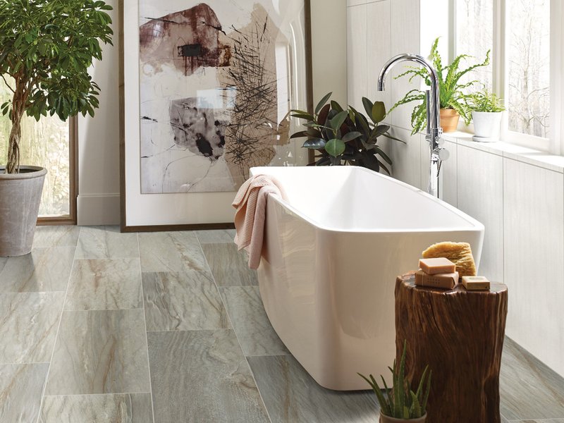 standalone beige tub on tile floors - B D Flooring Inc